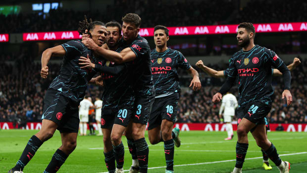 Manchester City's players pictured celebrating after a late goal scored by Nathan Ake (left) earned a 1-0 win at Tottenham Hotspur in the FA Cup in January 2024